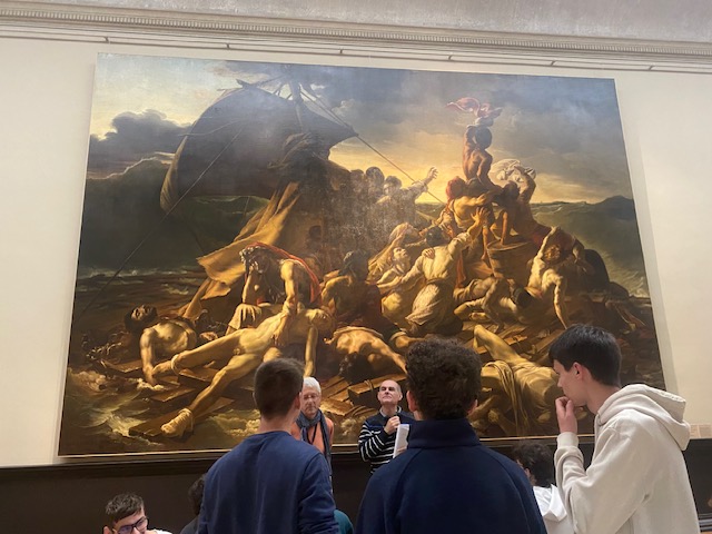 Un groupe d'élève devant une copie du Radeau de la Méduse de Géricault par Pierre-Désiré Guillemet.